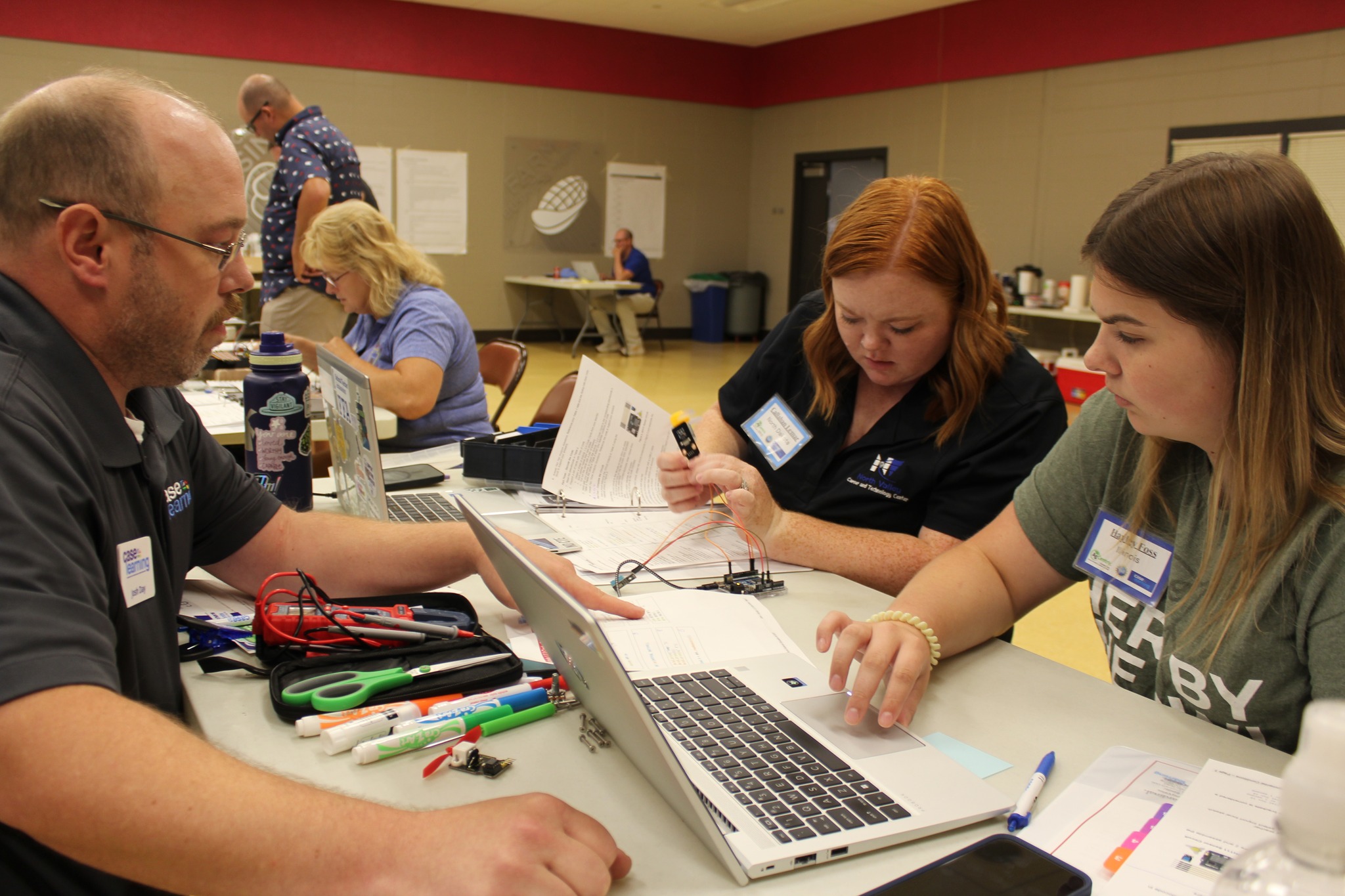 ARA field test participants working with robotics equipment